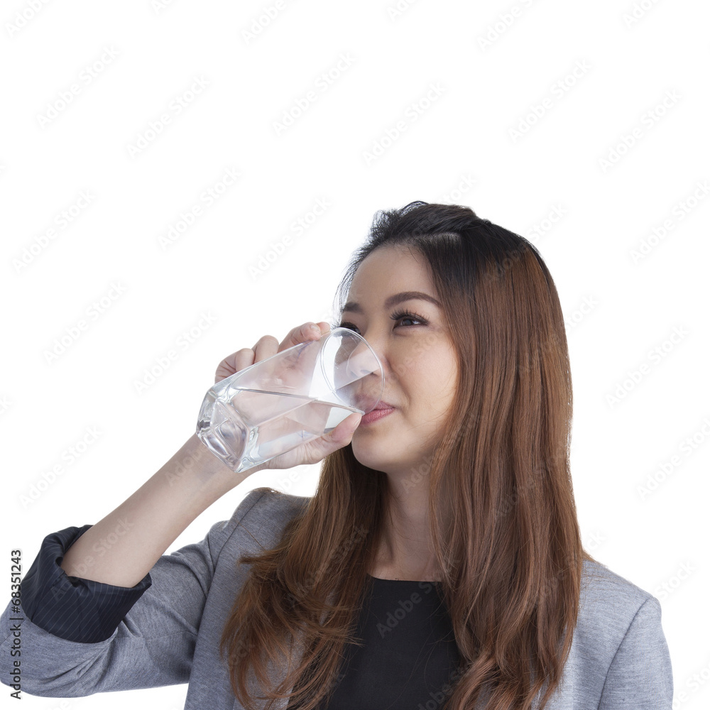 Young businesswoman drinking water on water glass Young businesswoman drinking water on water glass