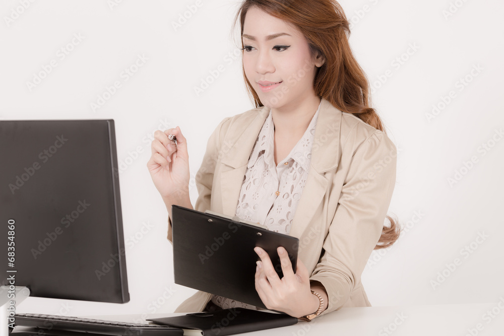 Portrait of a young business woman using laptop at office Portrait of a young business woman using laptop at office