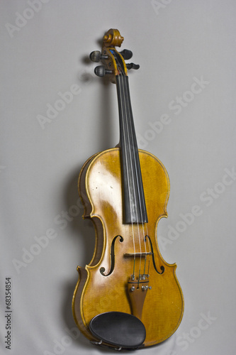 beautiful violin on a gray background