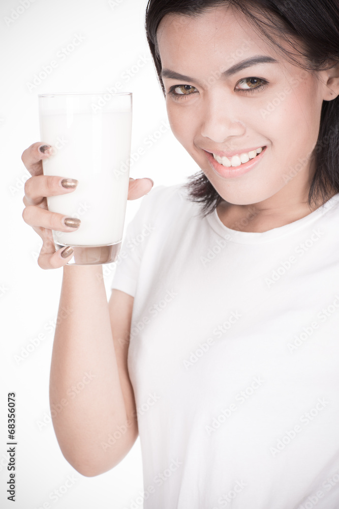 Laughing young woman with a glass of milk Laughing young woman with a glass of milk