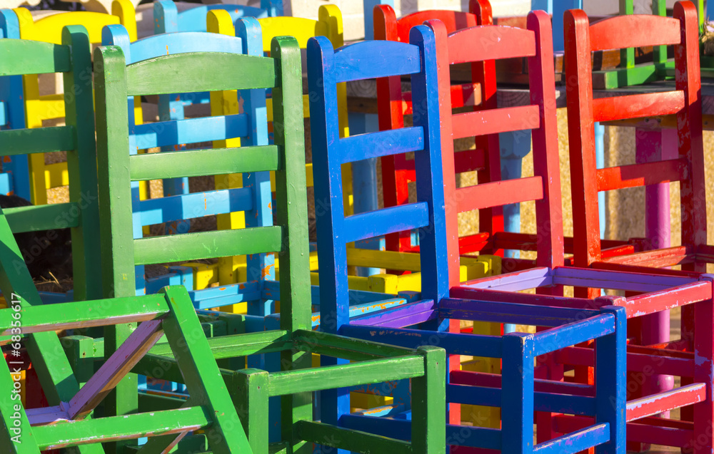 many chairs of different colors together many chairs of different colors together