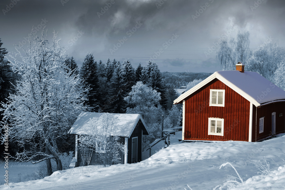 old red cottages in winter time, snowy swedish scenery