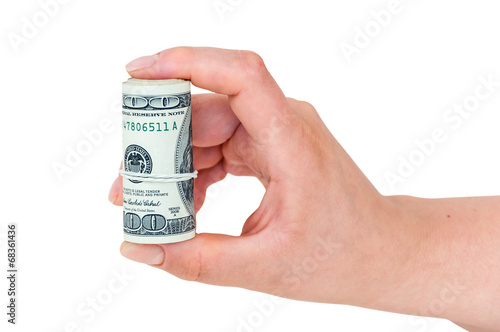 Hand holding rolled 100 dollars banknotes