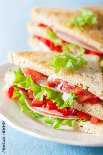 sandwich with ham tomato and lettuce photo