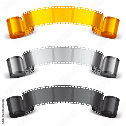 Three scrolls of color movie tapes.