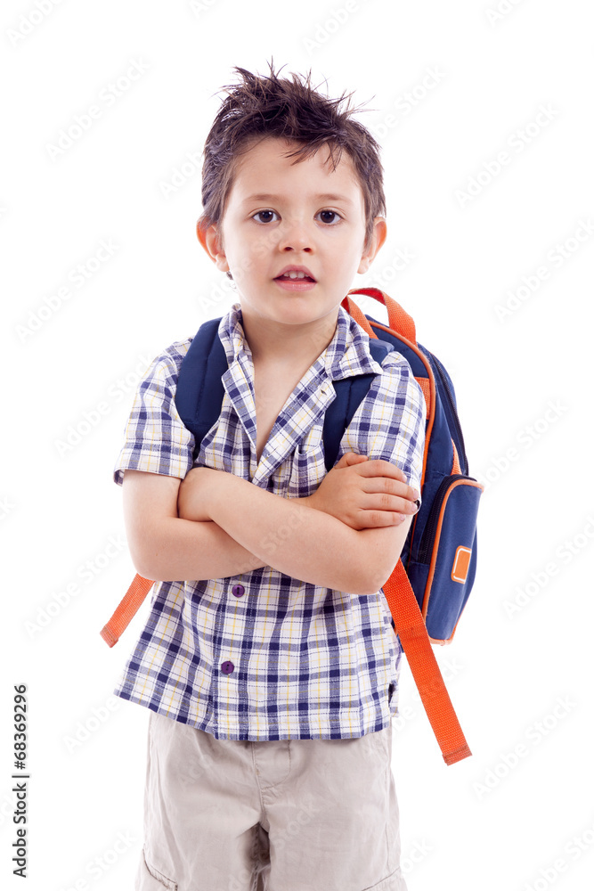 Portrait of school kid standing with arms crossed, isolated on w Portrait of school kid standing with arms crossed, isolated on w