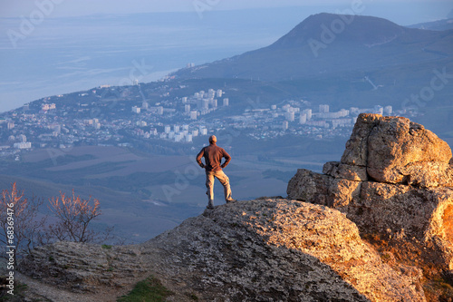 Man on the top of the mountain © Nickolay Khoroshkov