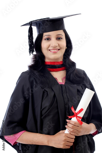 Happy young female student holding diploma