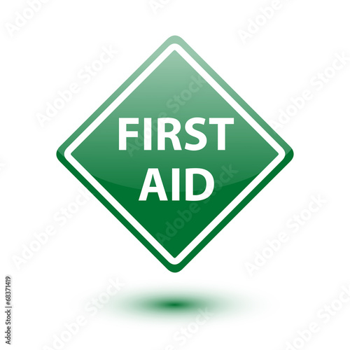 First aid green sign on white