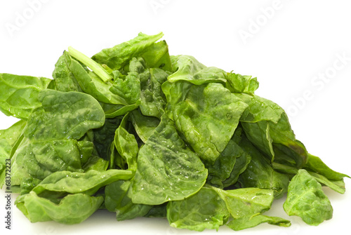 Fresh green leaves spinach on a white background