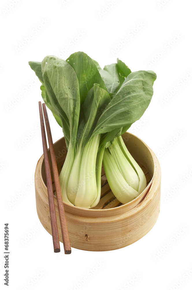 vegetarian chinese food in bamboo basket on white background vegetarian chinese food in bamboo basket on white background