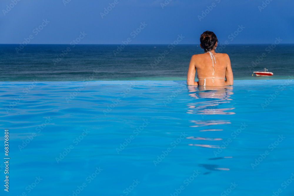 Woman in the infinity pool