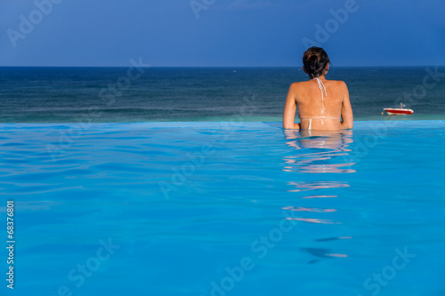 Woman in the infinity pool