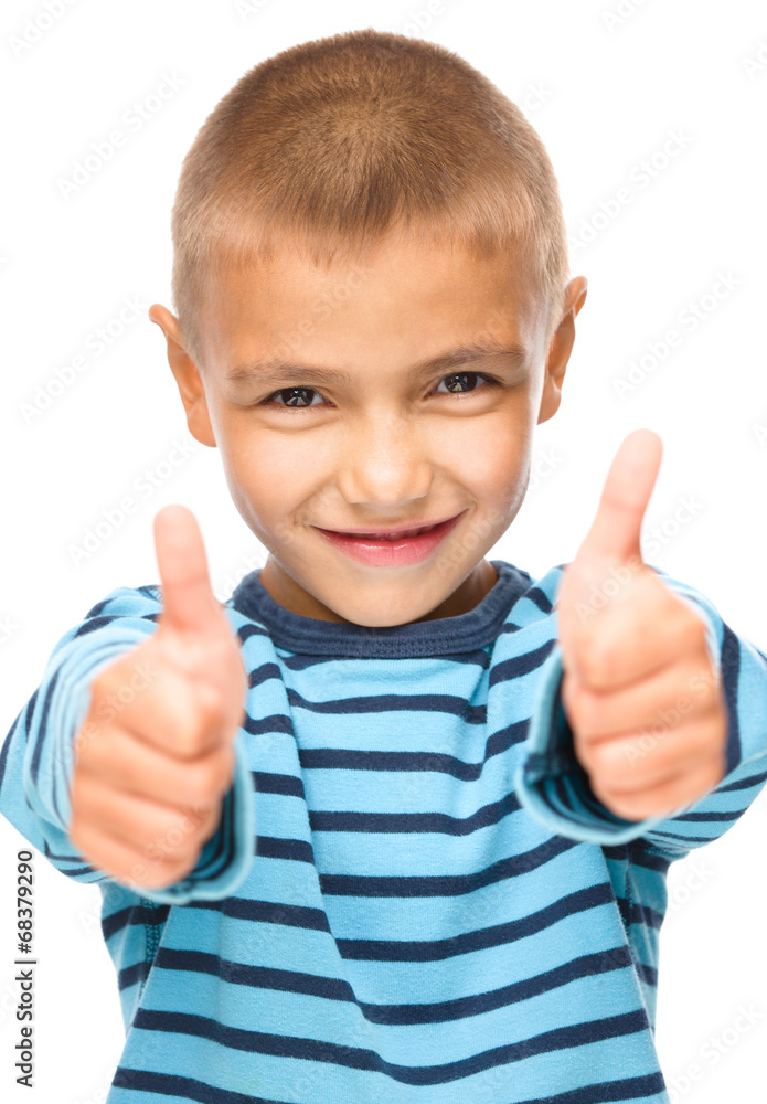 Portrait of a cute boy showing thumb up sign Portrait of a cute boy showing thumb up sign