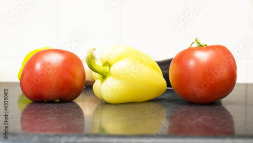 Fototapeta Naklejka Na Ścianę i Meble -  paprika tomatoes and other vegetables on the table