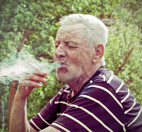 An old man smoking a cigarette