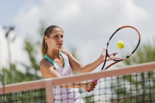 Young woman playing tennis