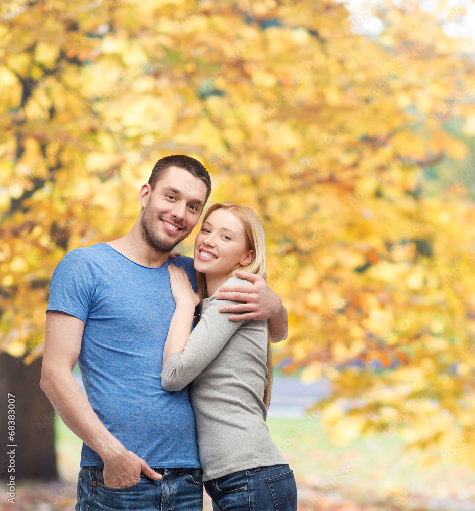 smiling couple hugging smiling couple hugging