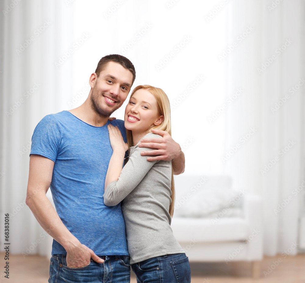 smiling couple hugging smiling couple hugging