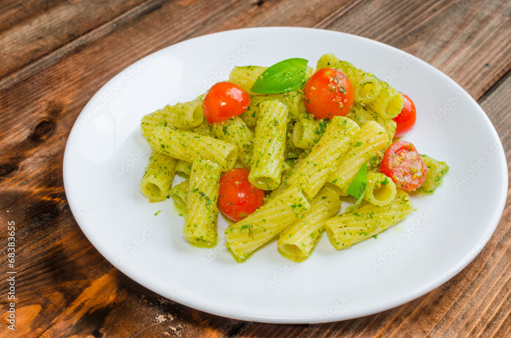 Rigatoni pasta with genoese pesto and sherry tomato Rigatoni pasta with genoese pesto and sherry tomato