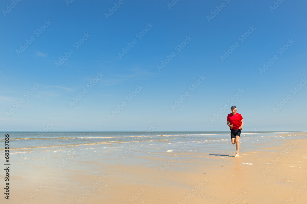 Senior runner at the beach