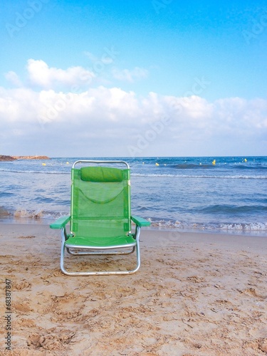 Fototapeta Naklejka Na Ścianę i Meble -  beach chair at the sea shore