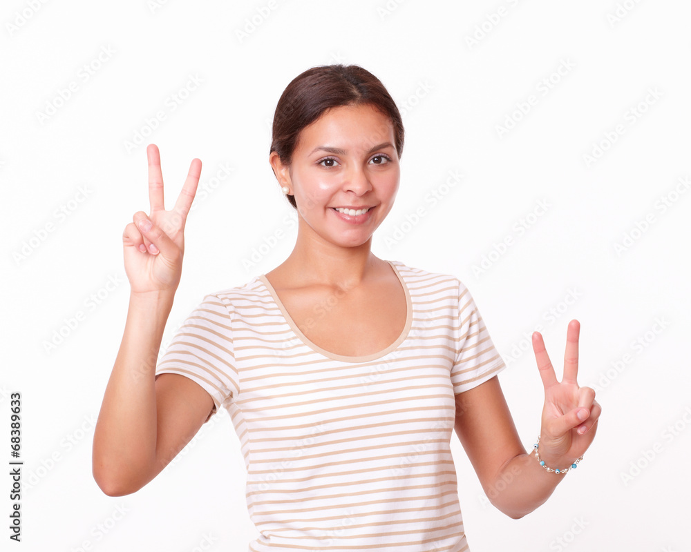 Alone beautiful girl with two winning sign Alone beautiful girl with two winning sign