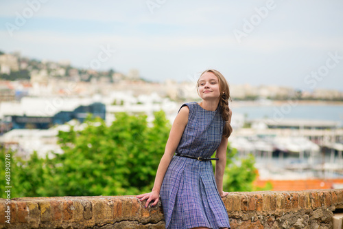 Elegant young woman in the Old town of Cannes photo