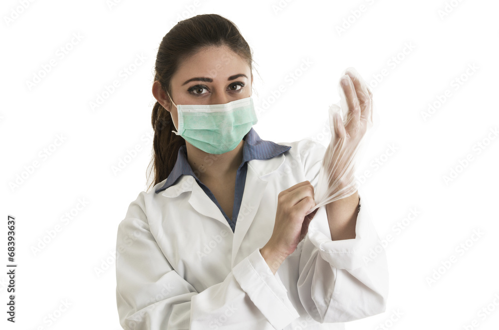 Young female doctor wearing gloves and mask Young female doctor wearing gloves and mask