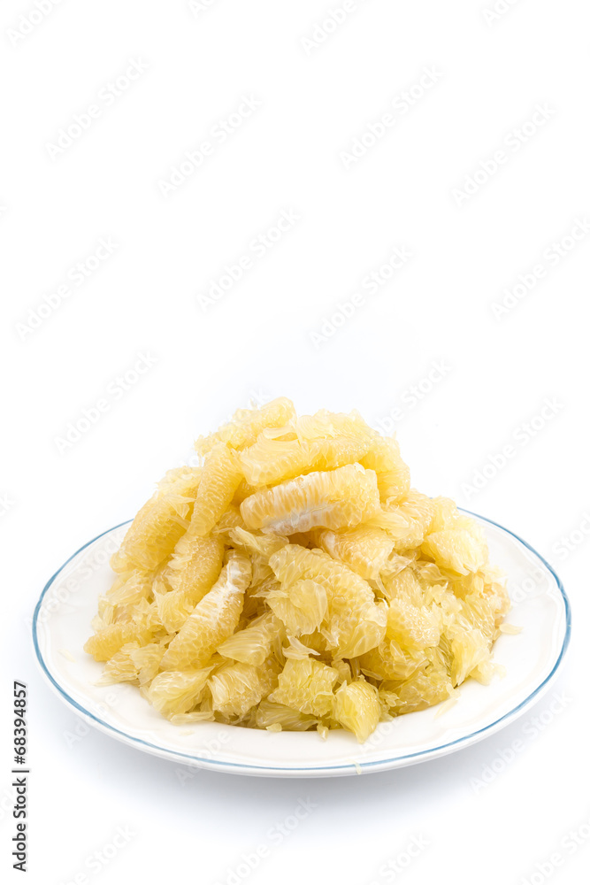 pomelo slices on dish in pyramid shape pomelo slices on dish in pyramid shape