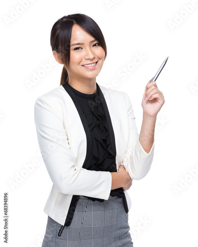 Businesswoman with pen point out