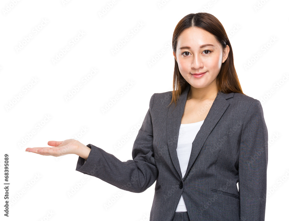 Indonesian mixed race businesswoman present by hand Indonesian mixed race businesswoman present by hand