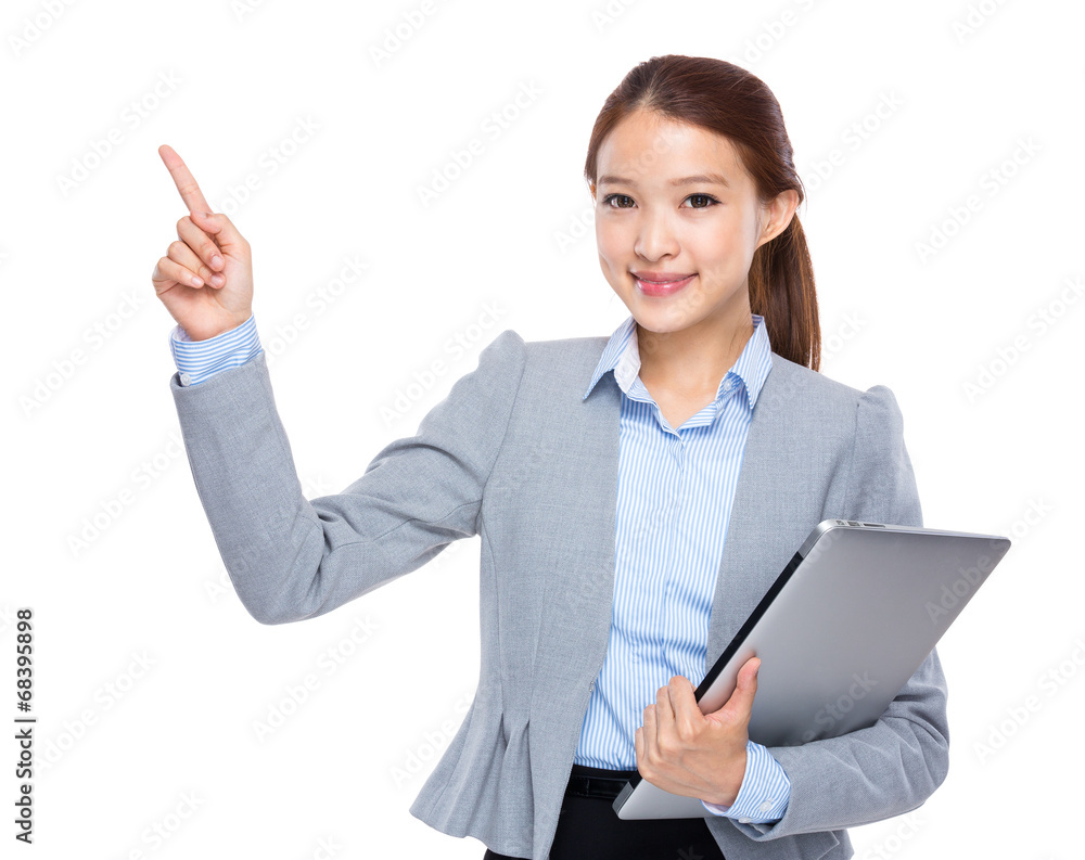 Businesswoman with laptop computer and finger point up Businesswoman with laptop computer and finger point up