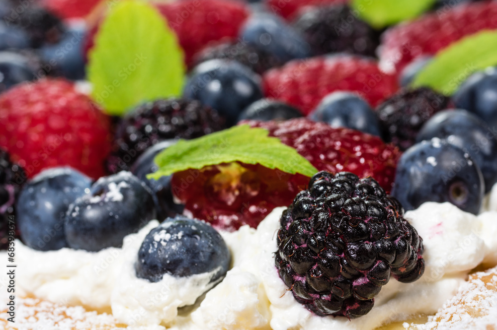 Closeup of fresh berry tart with cream Closeup of fresh berry tart with cream