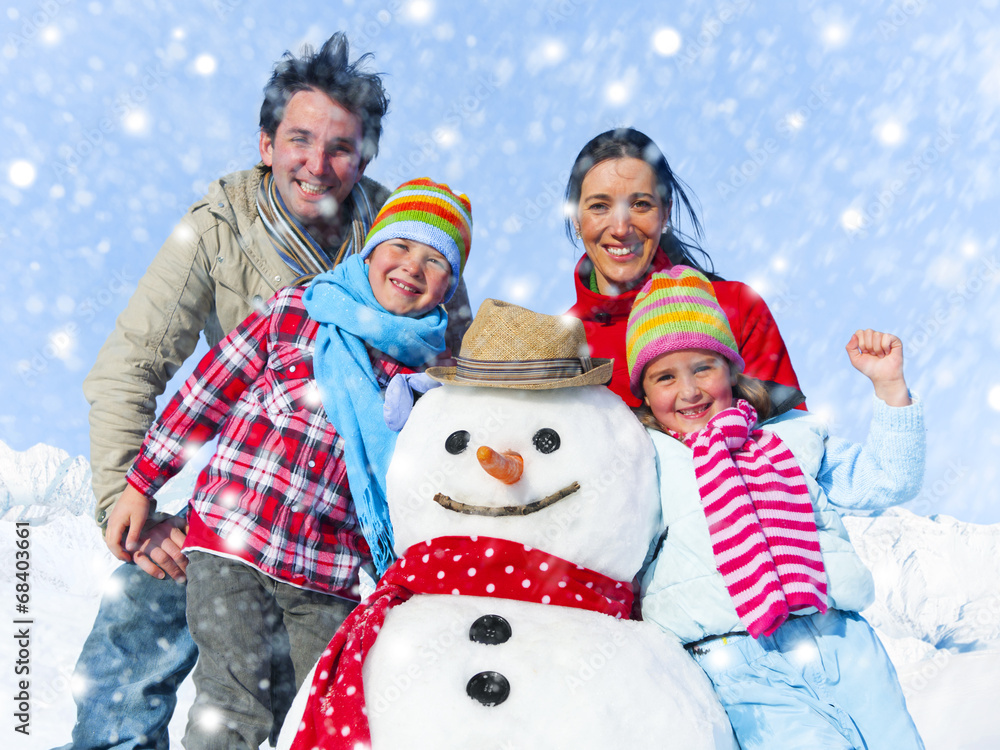 Family Posing With A Snowman Outdoors