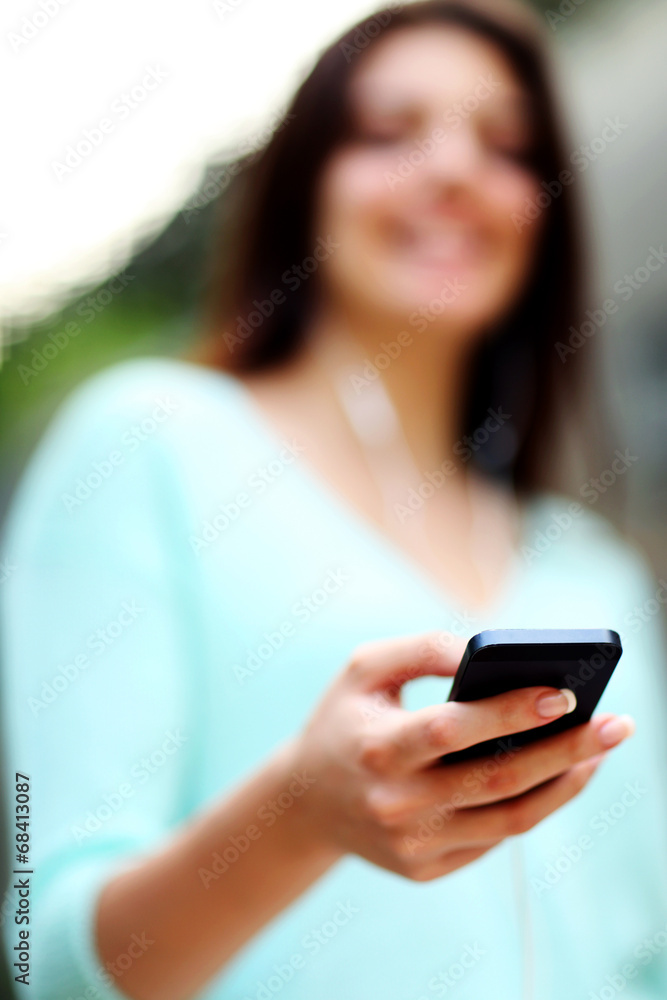 Closeup portrait of a woman using smartphone Closeup portrait of a woman using smartphone
