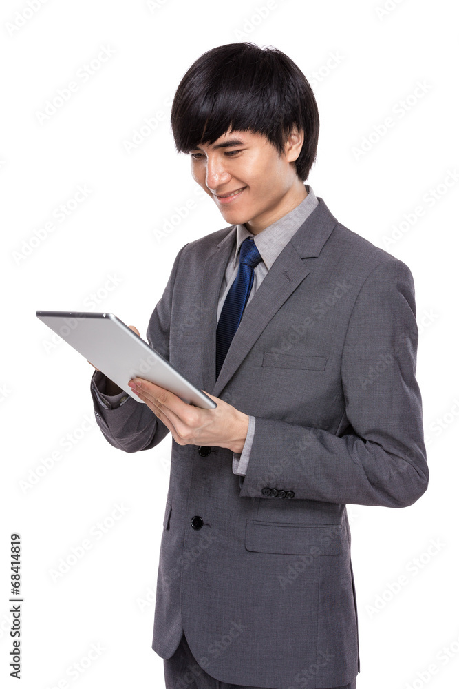 Young businessman look at digital tablet Young businessman look at digital tablet