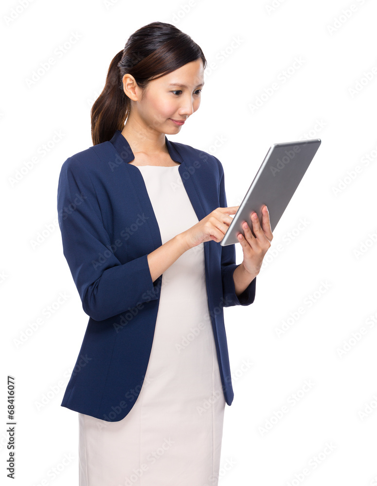 Asian businesswoman look at digital tablet Asian businesswoman look at digital tablet