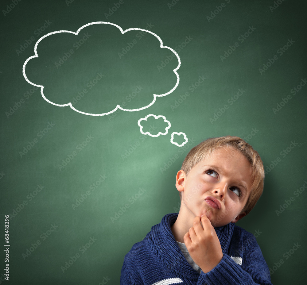 Thinking with thought bubble on blackboard Thinking with thought bubble on blackboard