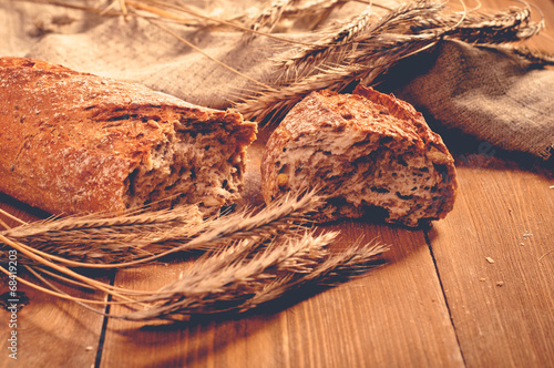 Vászonkép bread on wooden boards, touch-up in retro style
