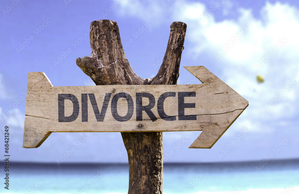 Divorce wooden sign with a beach on background