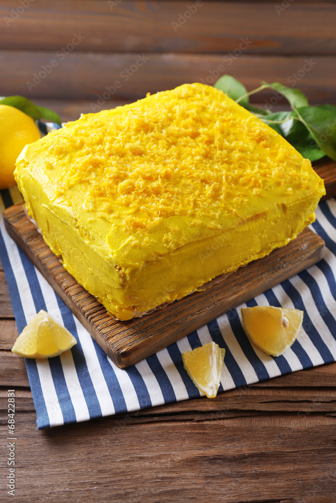 Tasty lemon cake on wooden table Tasty lemon cake on wooden table