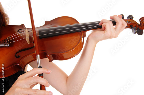 Closeup of violin playing.