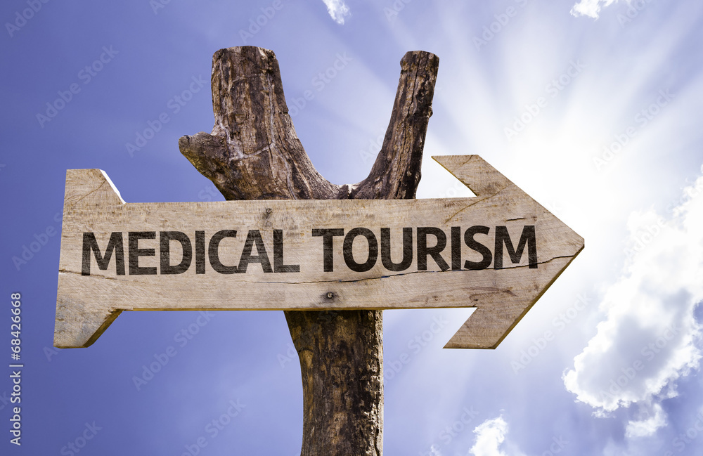 Medical Tourism wooden sign on a beautiful day