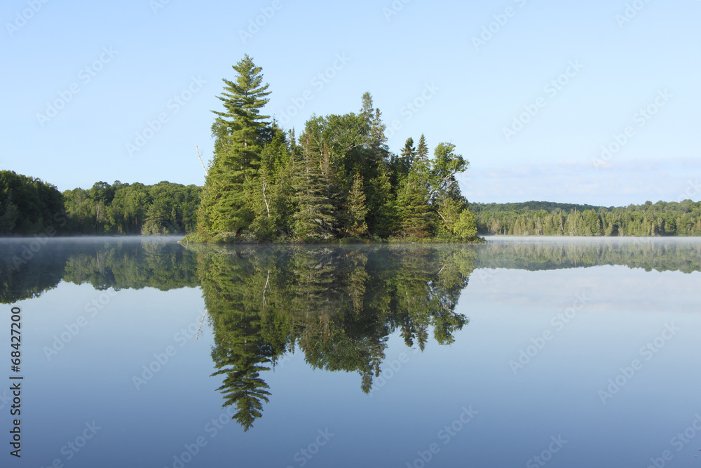 Island and Reflection on the Surface of a Lake - Ontario, Canada