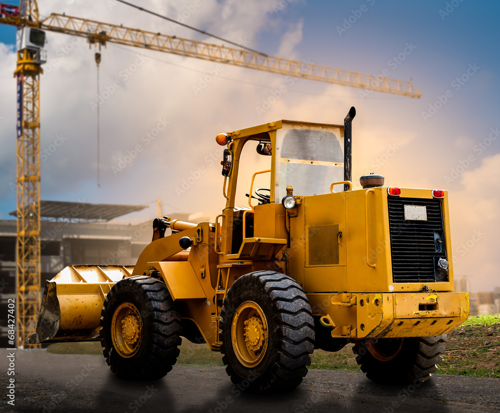 yellow tractor on the road yellow tractor on the road