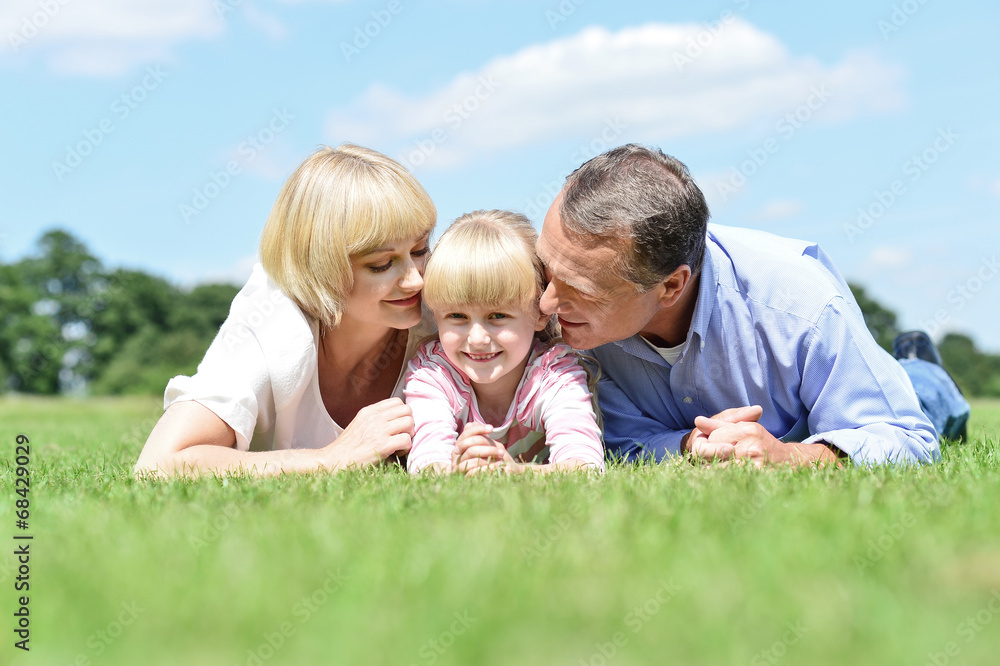 Parents kissing their sweet angel Parents kissing their sweet angel
