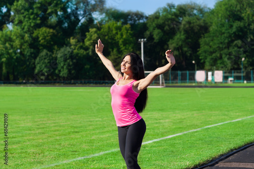 Woman sport excited raised arms up