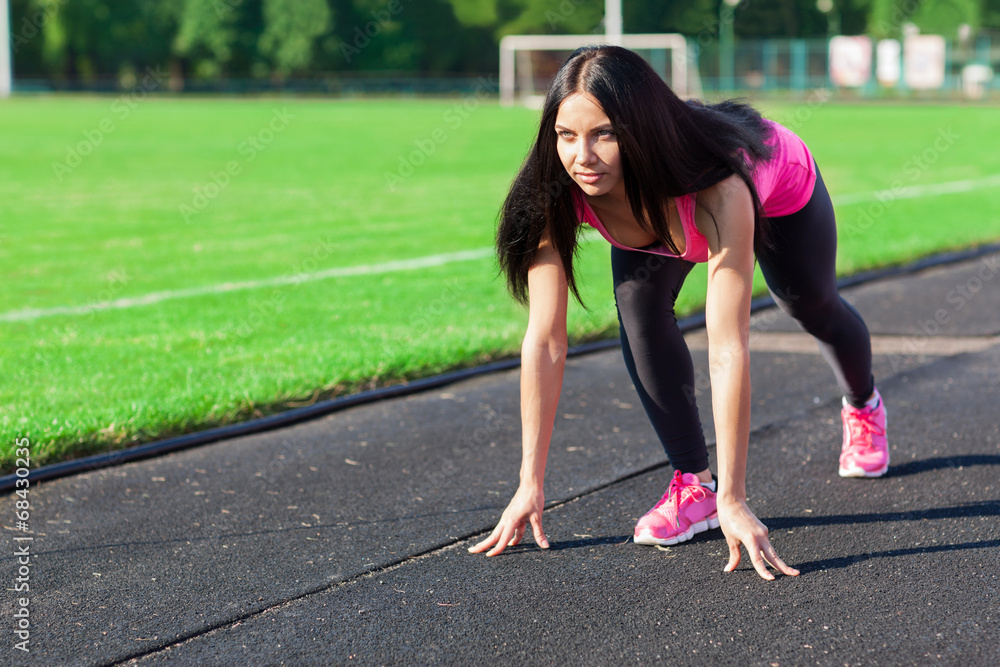 Woman smile start position on stadium Woman smile start position on stadium