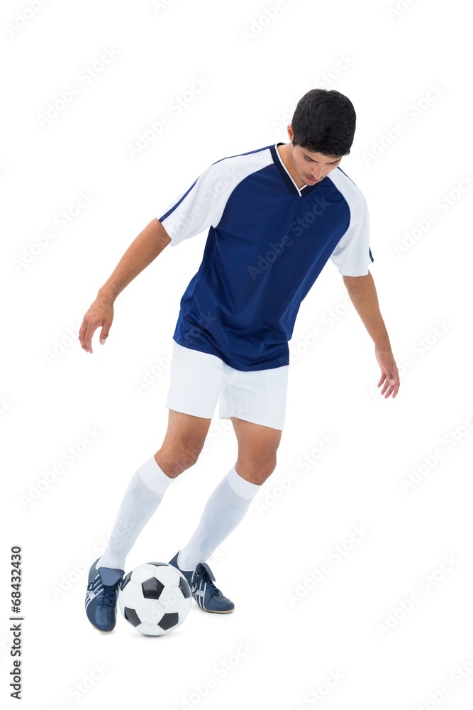 Football player kicking the ball